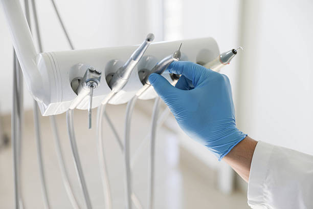 Professional Tooth Extraction technician working in Pelican Bay, TX